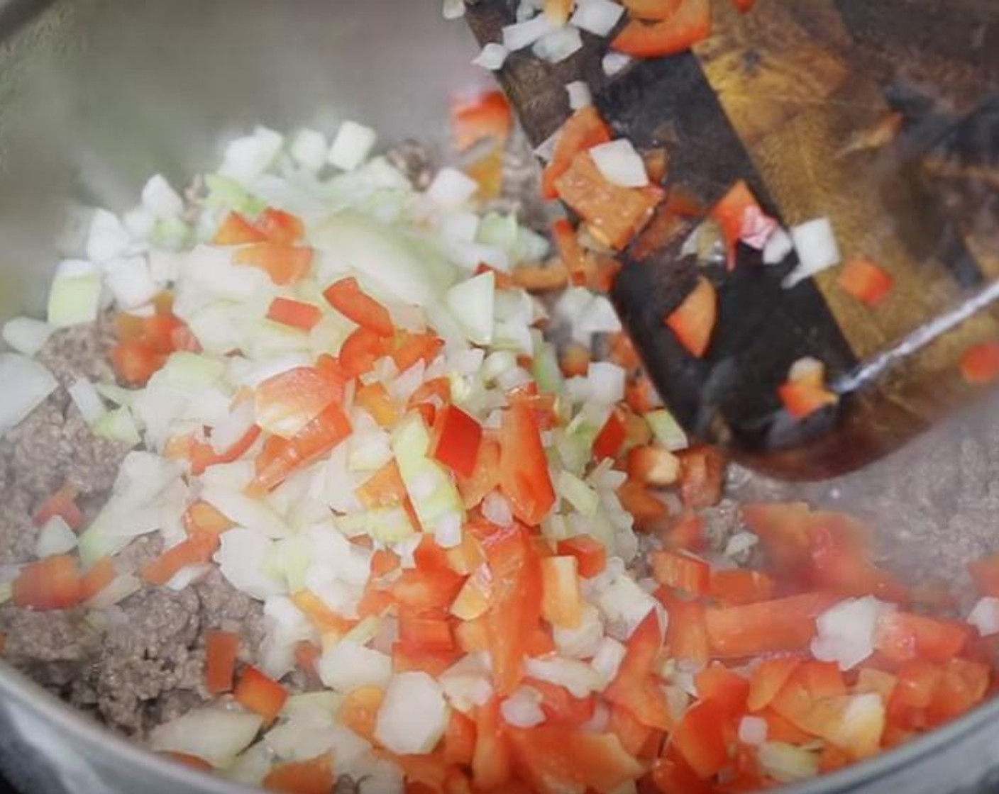 step 2 Add Onion (1), Red Bell Pepper (1), Garlic (2 cloves), Salt (1 tsp) and Ground Black Pepper (to taste). Cook for about three minutes, until onion is translucent.