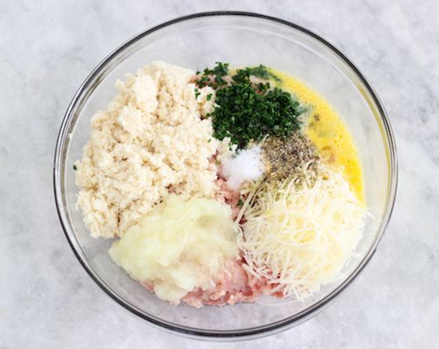 step 6 Add Ground Chicken (1 lb), Eggland's Best Classic Egg (1), Fresh Parsley (1 Tbsp), Parmesan Cheese (4 Tbsp), Salt (1/2 tsp), Ground Black Pepper (1/4 tsp), Simply Organic Garlic Powder (1/2 tsp), and Dried Mixed Herbs (1 tsp).