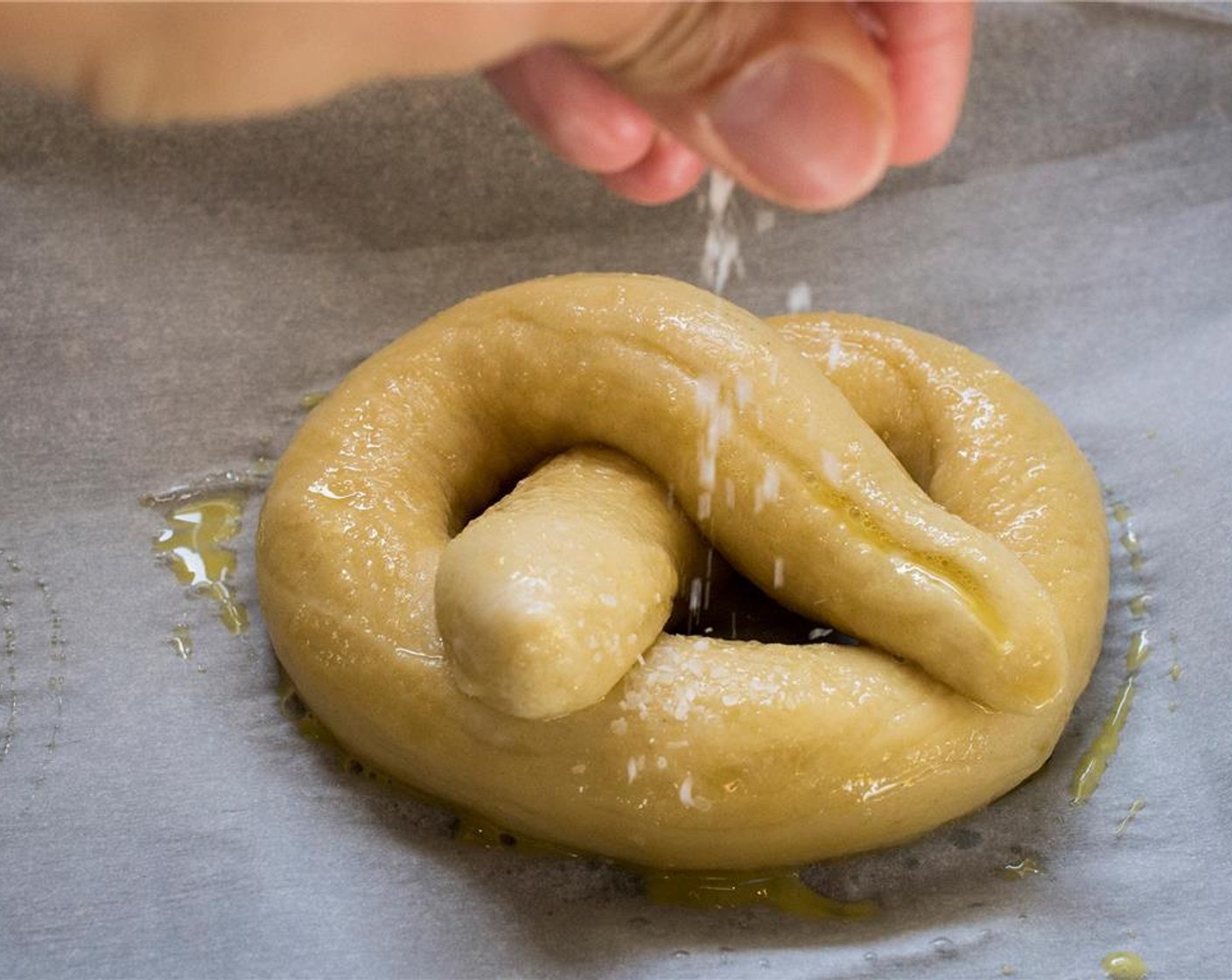 step 12 Beat Eggland's Best Classic Egg (1) yolk with 1 tablespoon of water. Brush each pretzel with the egg wash. Sprinkle with Sea Salt (to taste) just before transferring them to the oven. Place in the oven and bake for 15 to 18 minutes.