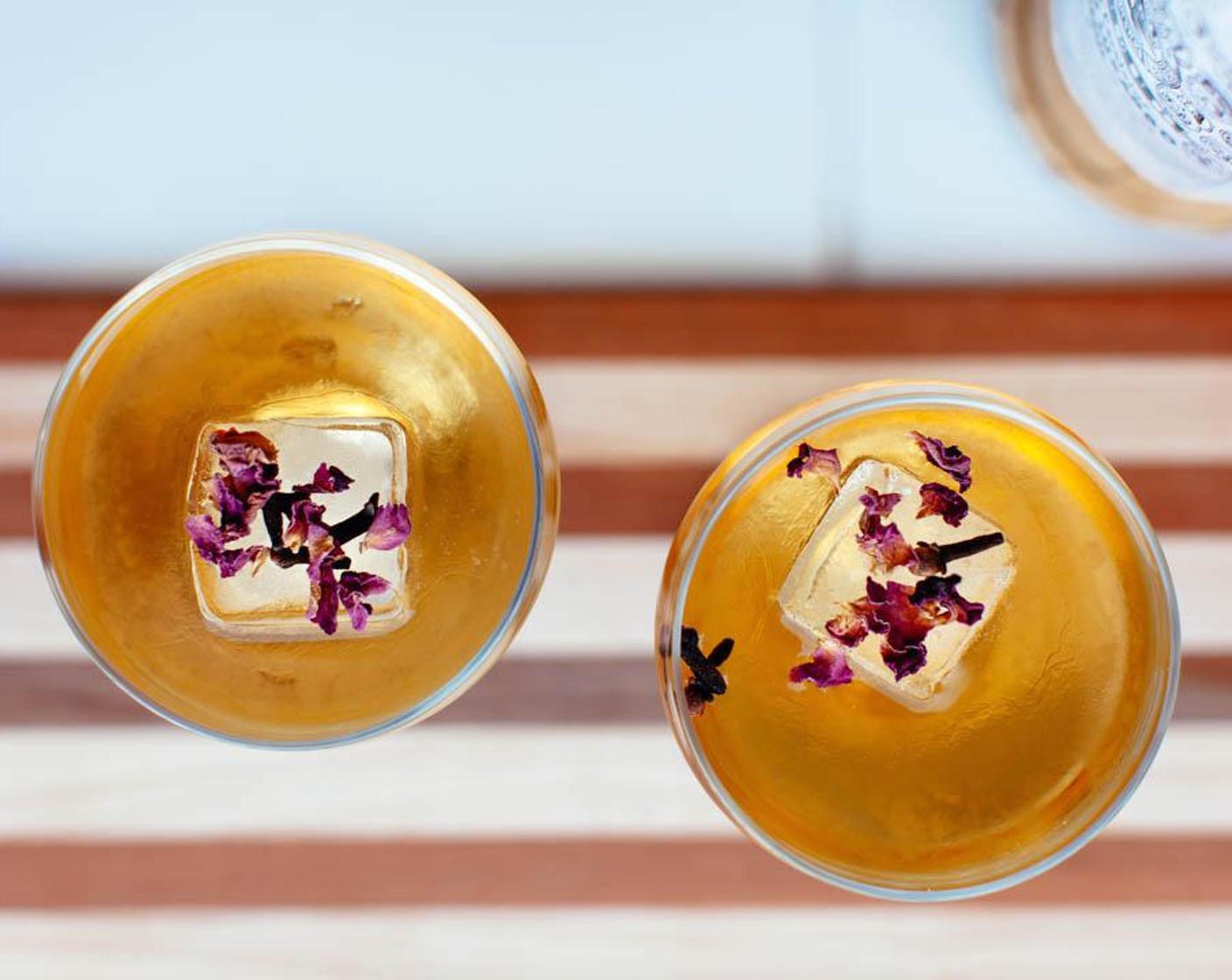 step 4 Garnish with Edible Dried Rose Petals (1 pinch) and Whole Clove (1 pinch).
