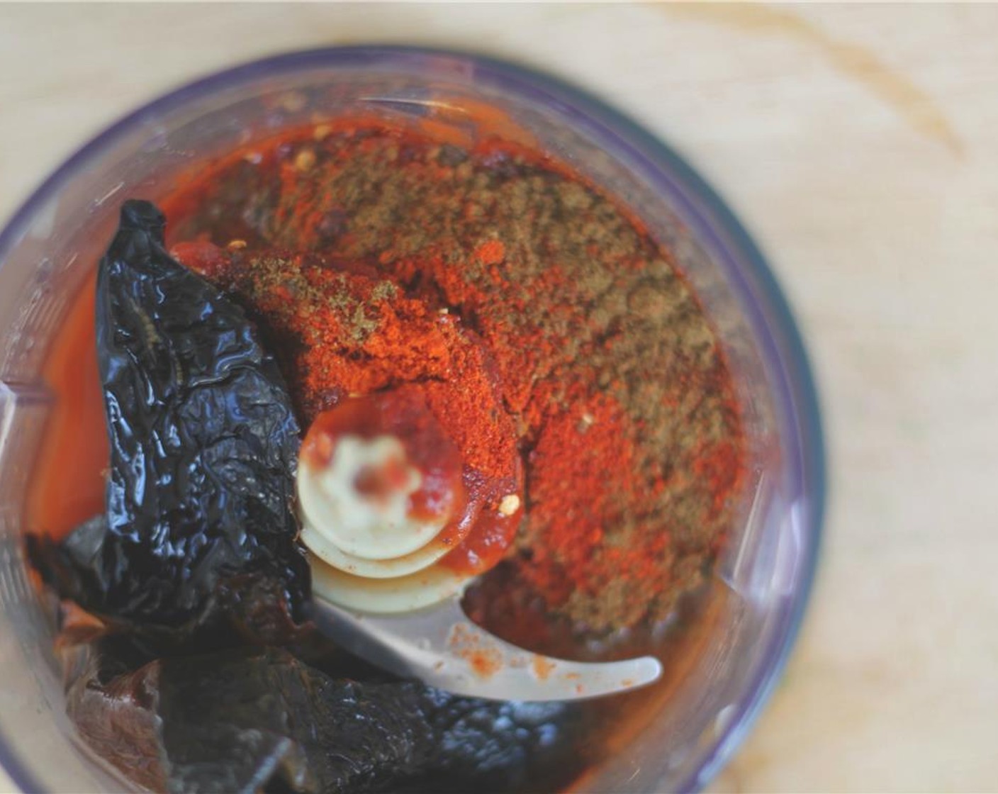 step 3 To make the chorizo flavoring, blend together the reconstituted pasillas with the Chipotle Peppers in Adobo Sauce (1 can), Paprika (1 tsp), Cayenne Pepper (1 tsp), Mexican Chili Powder (1 tsp), Crushed Red Pepper Flakes (1 Tbsp), Ground Cumin (1 tsp), Ground Ginger (1 tsp), Ground Coriander (1 tsp), Ground Cloves (1 pinch), Salt (1 tsp), Distilled White Vinegar (1 Tbsp), and Tahini (2 Tbsp).