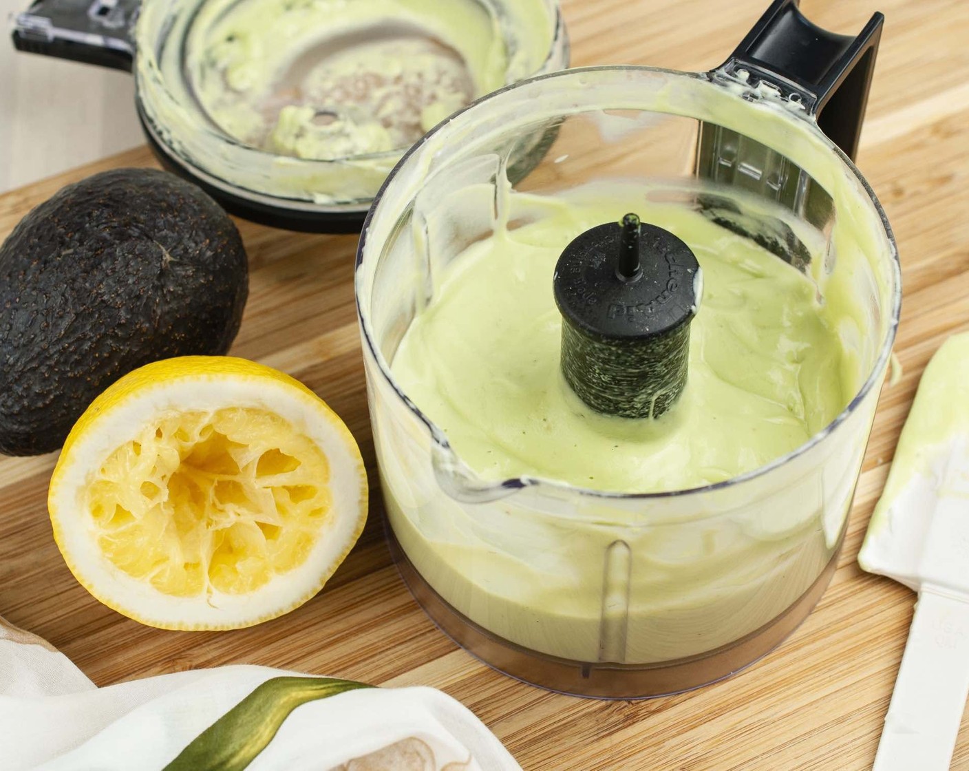 step 9 Scoop out flesh into the bowl of a food processor or blender. Add Fat-Free Yogurt (4 Tbsp), Olive Oil (1 Tbsp), Lemon (1/2), Kosher Salt (1 pinch), and Ground White Pepper (1 pinch). Blend until smooth. With processor running, slowly add Water (4 Tbsp) until desired consistency is reached.