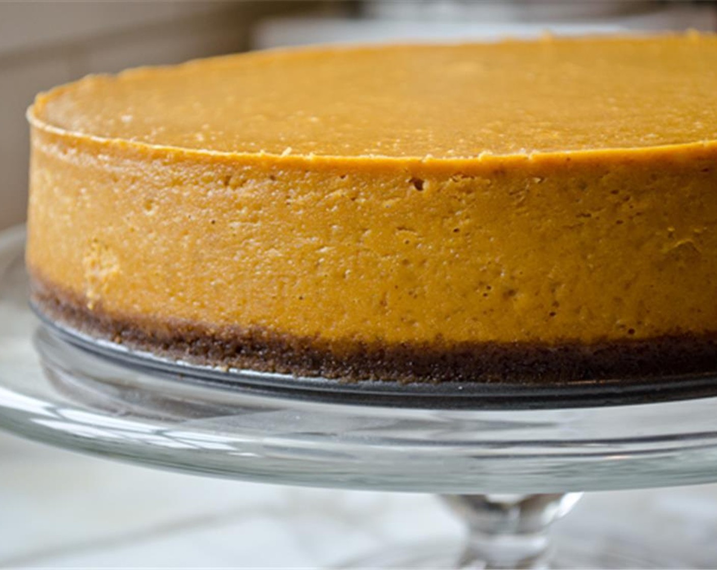 step 17 To serve, remove the springform pan and slide the cheesecake onto a serving platter (or you can keep it on the pan bottom). Let the cheesecake stand at room temperature for about 30 minutes.