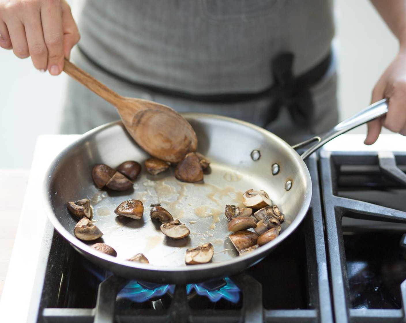 step 8 Over high heat, add Olive Oil (1 Tbsp) to the pan. When the oil is hot, add the mushrooms. Season with a pinch of Salt (to taste) and Ground Black Pepper (to taste) and sauté for 2 minutes or until tender. Remove from heat; hold. Stir Basil Pesto (4 Tbsp) into the quinoa.