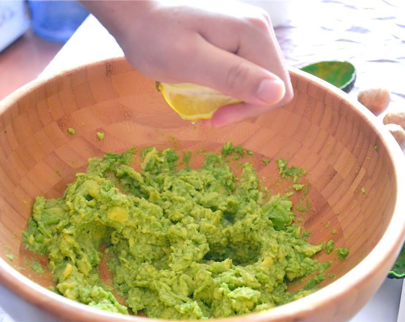 step 8 Cut the Lime (1) in half and squeeze all the juice into the bowl.