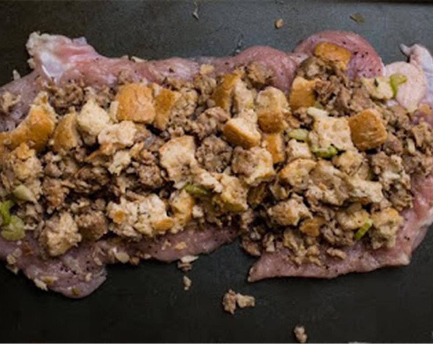 step 8 Spread the uncooked dressing over the meat (not too thick), leaving a 1/2-inch boarder on all sides.