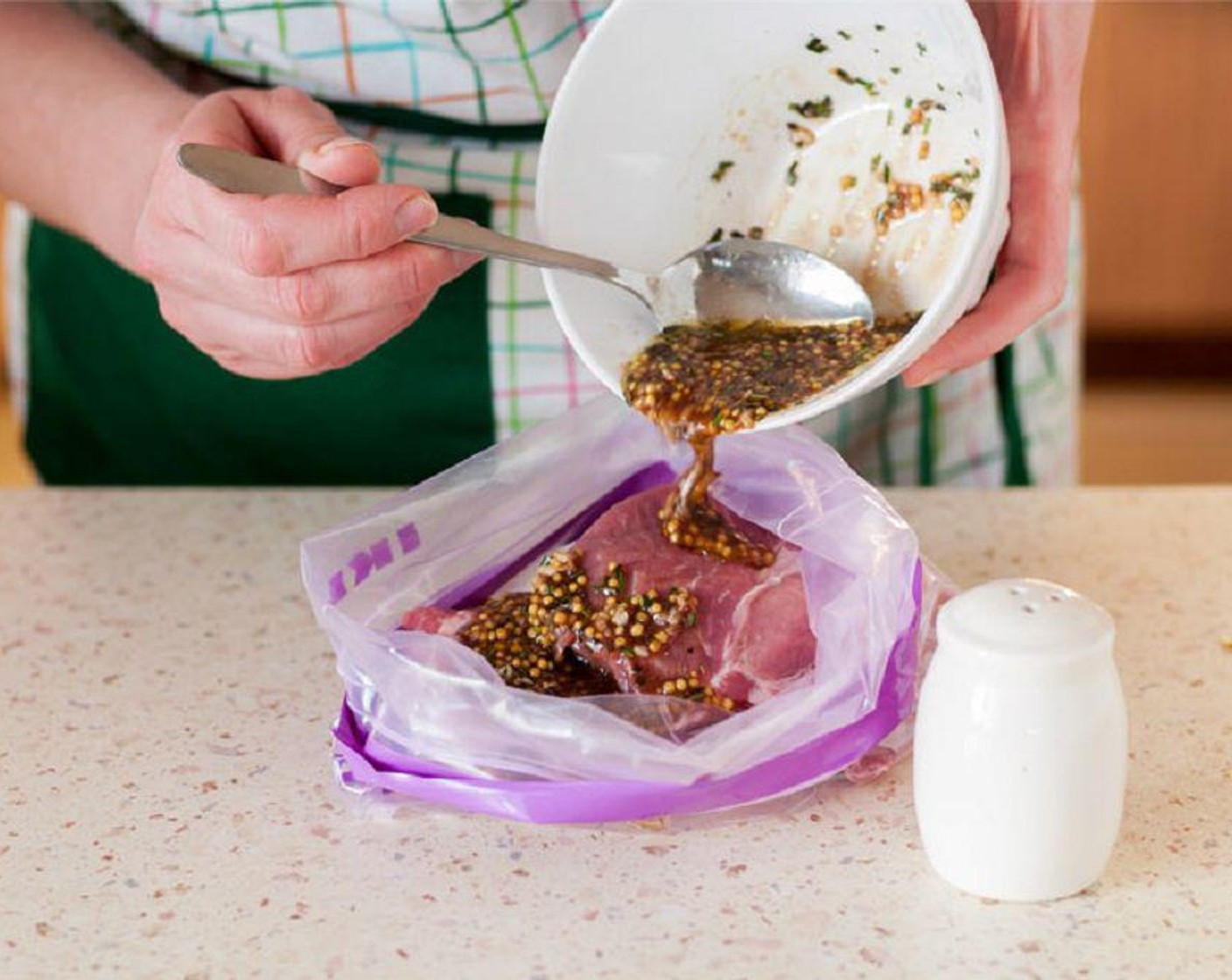 step 2 Whisk together the Extra-Virgin Olive Oil (2 Tbsp), Dried Rosemary (1/2 tsp), Paprika (1/2 tsp), Dried Sage (1/2 tsp), and Salt (1/2 tsp) and Ground Black Pepper (1/2 tsp) in a small bowl. Pour mixture over the pork chops.
