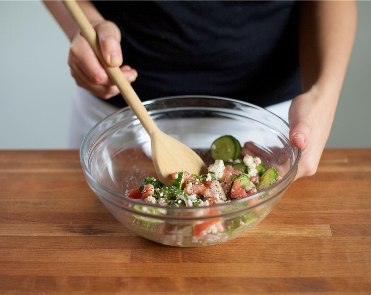 step 7 Add Olive Oil (1 Tbsp), Red Wine Vinegar (2 tsp), Feta Cheese (2/3 cup), Salt (1/4 tsp) and Ground Black Pepper (1/4 tsp) to the large bowl with the salad ingredients. Gently mix the ingredients together and set aside.