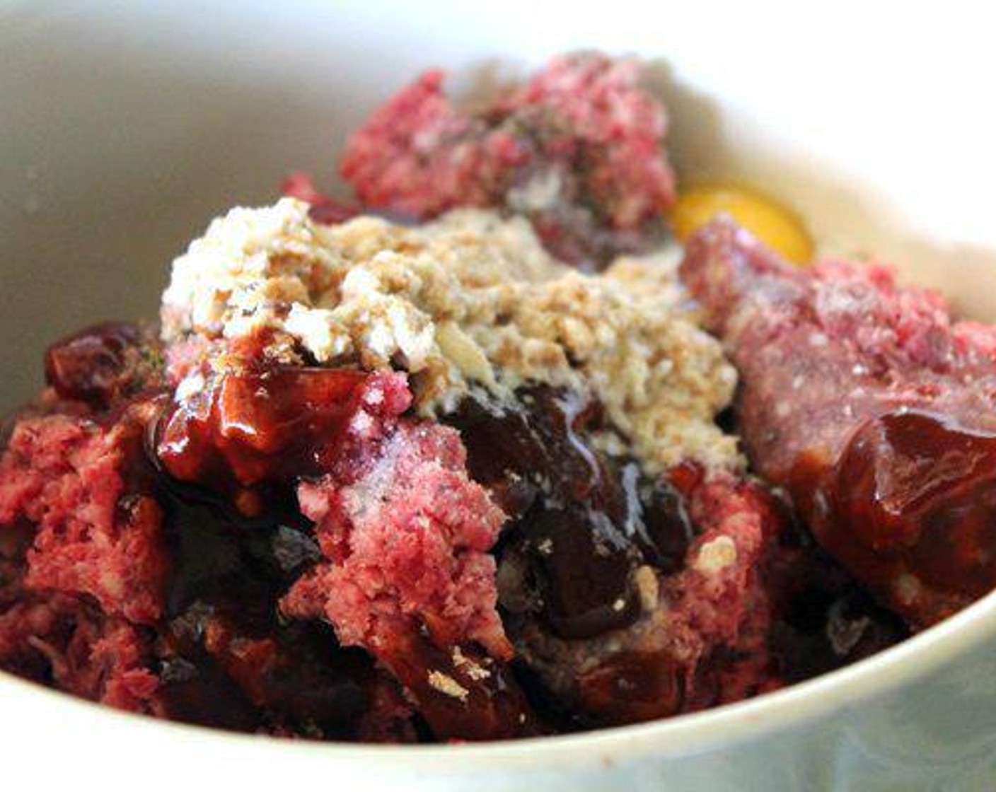 step 4 In a large bowl, combine the Ground Beef (2 lb), crumb and milk mixture, Eggland's Best Classic Egg (1), Garlic (1 tsp), Salt (1/2 tsp), Ground Black Pepper (1/2 tsp) and half of the Barbecue Sauce (4 Tbsp). With your hands, mix the meatballs until combined.