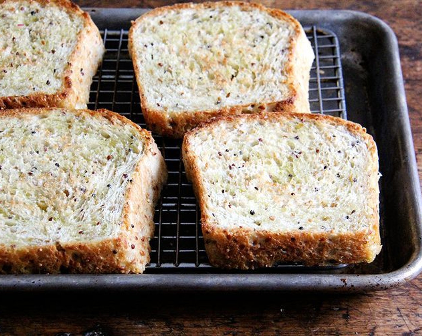 step 12 Remove pan from oven, flip slices of bread over, drizzle with more oil, and return pan to the oven for another 2 minutes, or until bread is golden.