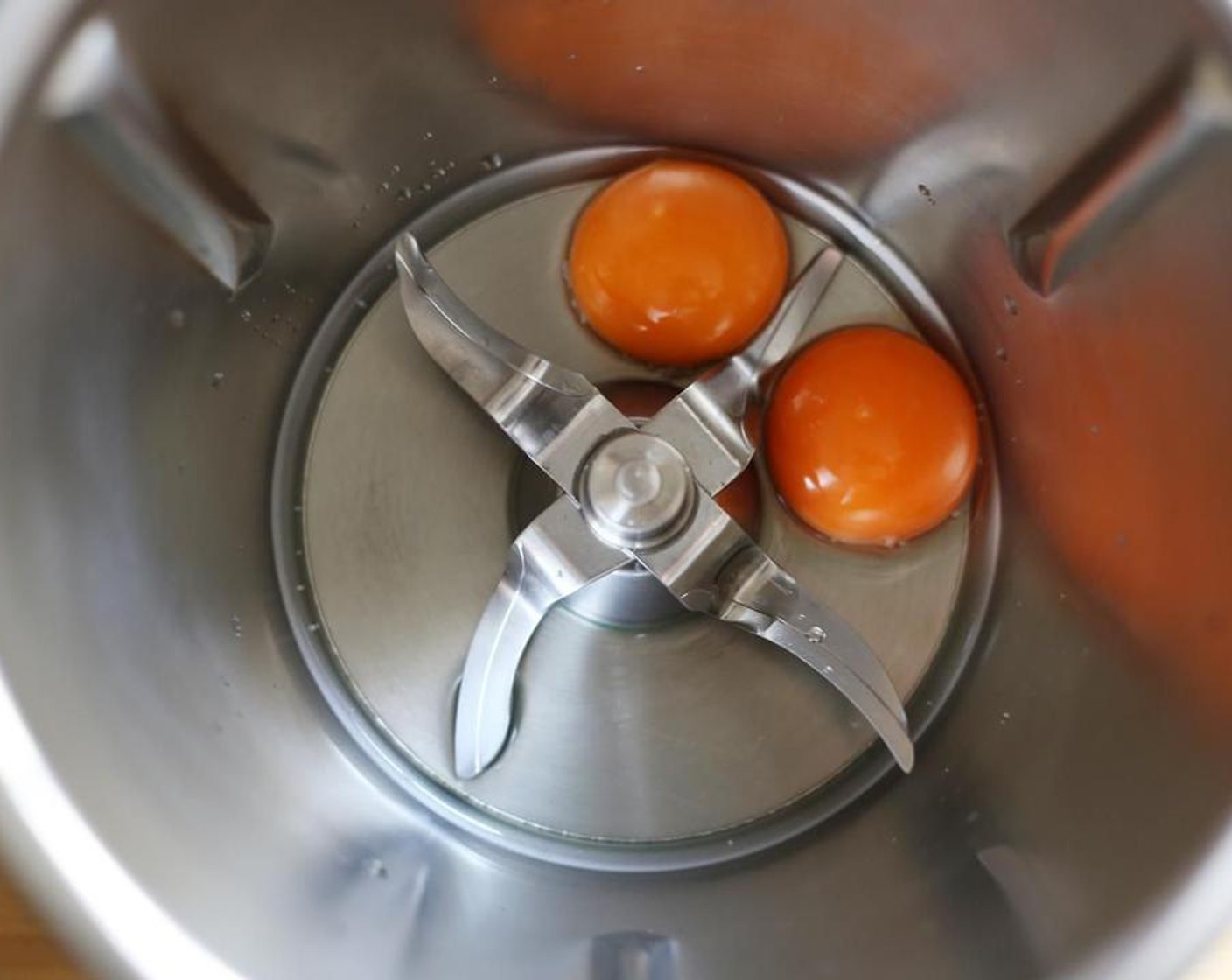 step 1 For the Gochujang Mayo, combine the yolks of the Eggland's Best Classic Eggs (2) and White Wine Vinegar (2 Tbsp) in a high speed blender and blend on high until combined.