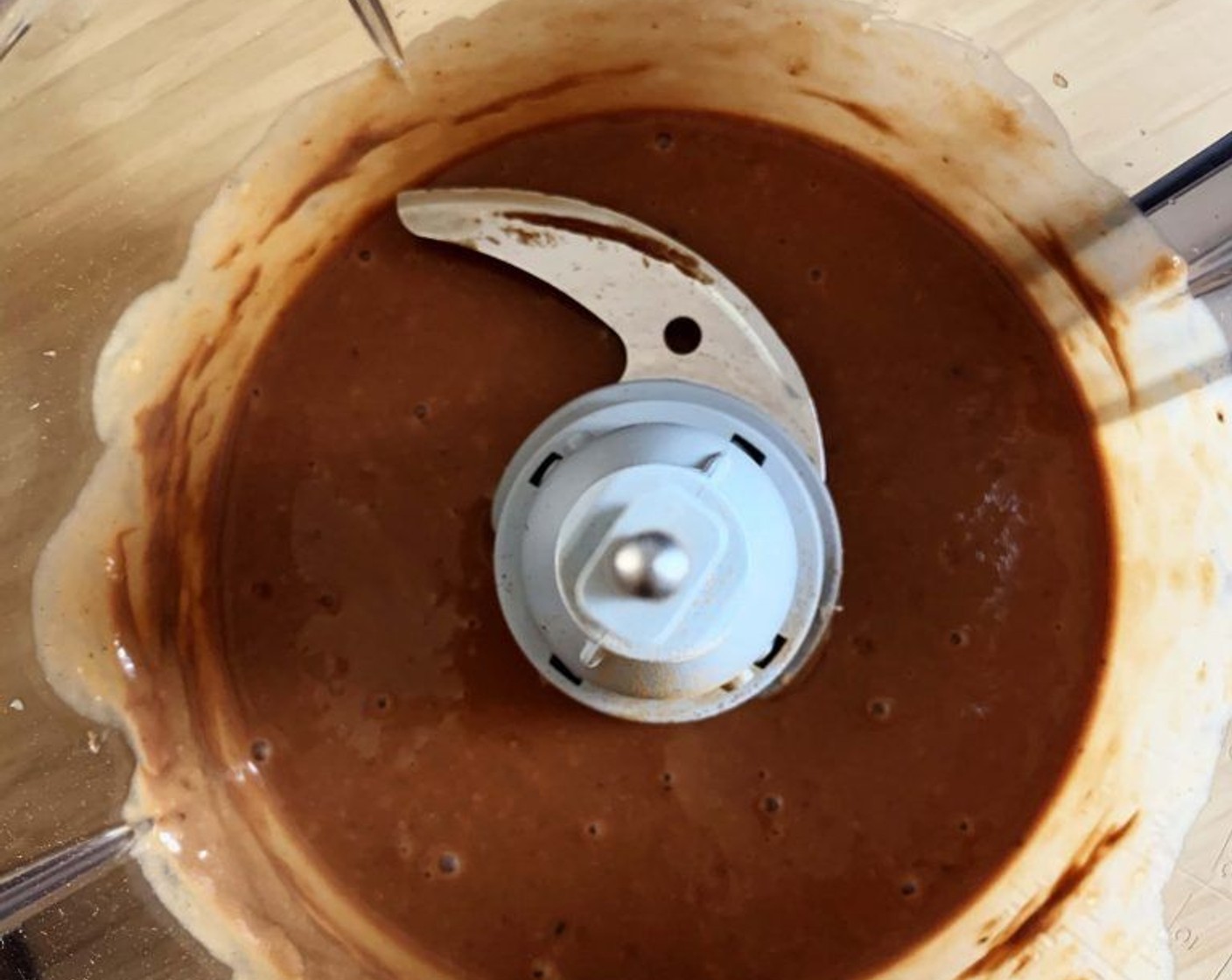 step 2 Place the Banana (1 cup), Chocolate Hazelnut Spread (3 Tbsp), Protein Powder (1 scoop), Simply Organic Cinnamon, Ground (1 dash), Pink Himalayan Sea Salt (1 pinch) and Coconut Oil (1 tsp) into a food processor and blend until a smooth paste form
